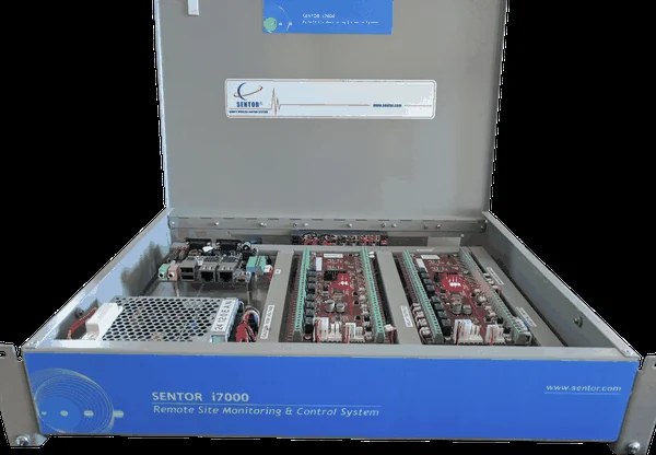 Sentor remote site monitoring controller with the lid open, showing the motherboard, terminal blocks and expansion card slots